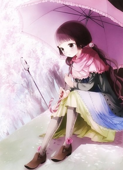 Sitting with the umbrella under the sakura trees